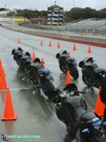 Demo Bikes II: Looking up the pit lane with the Buell 1125R demo bikes lined up.