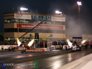 Night Fire: JR Todd and Steve Torrence (far lane) light up the night.